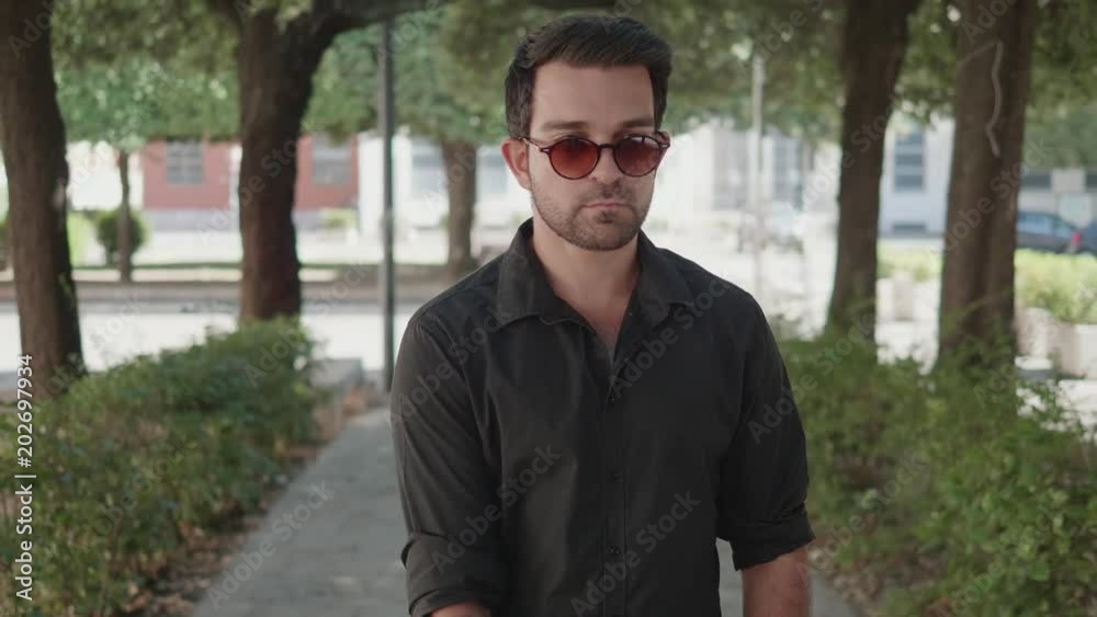 blindness, autonomy- Young blind man walking alone with his cane blindness, autonomy- Young blind man walking alone with his cane