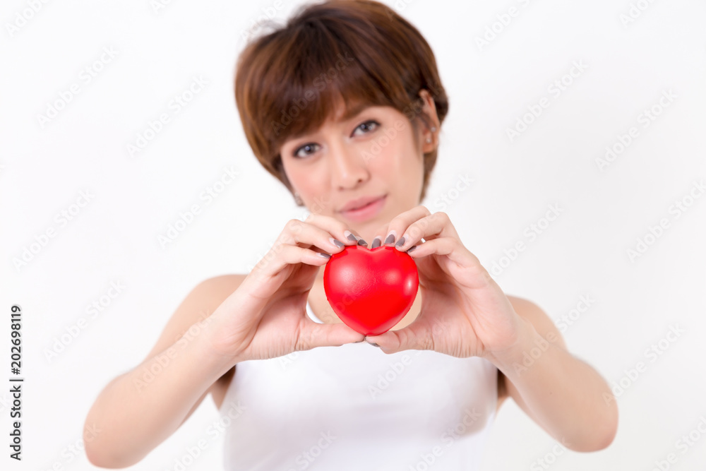 Beautiful young asia woman with red heart. Isolated on white background. Studio lighting. Concept for healthy.