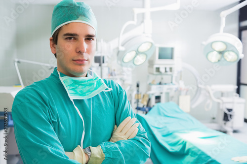 Surgeon with arms crossed