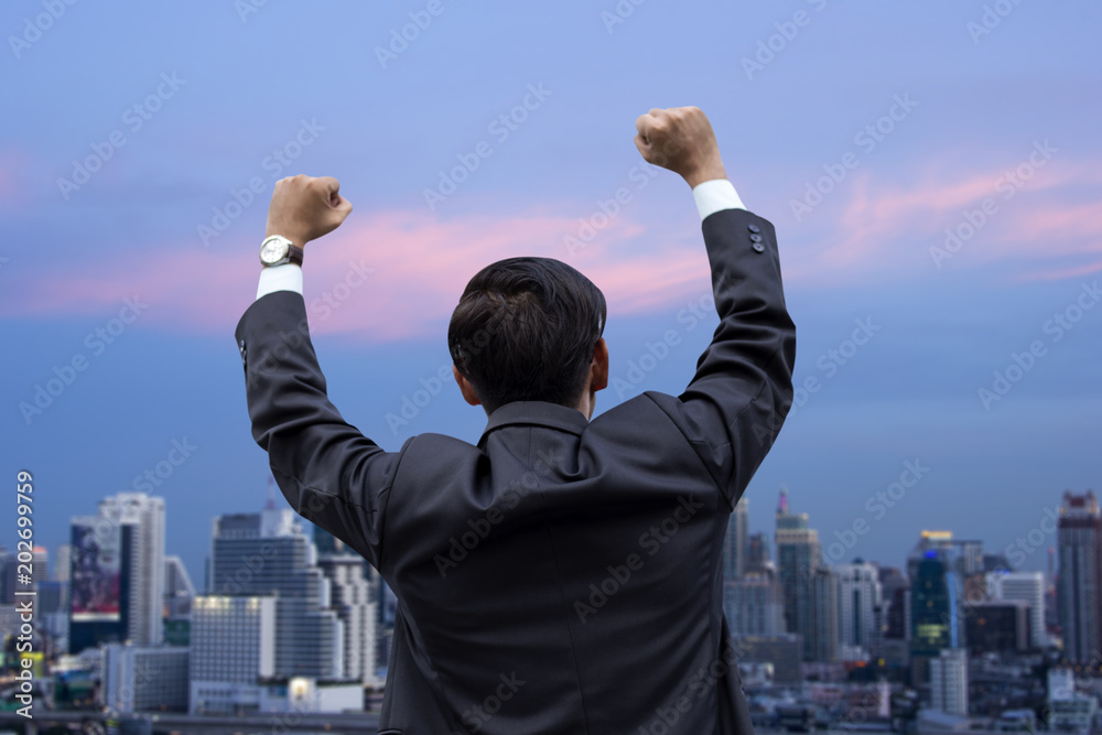 success business man enjoying in the city background success business man enjoying in the city background