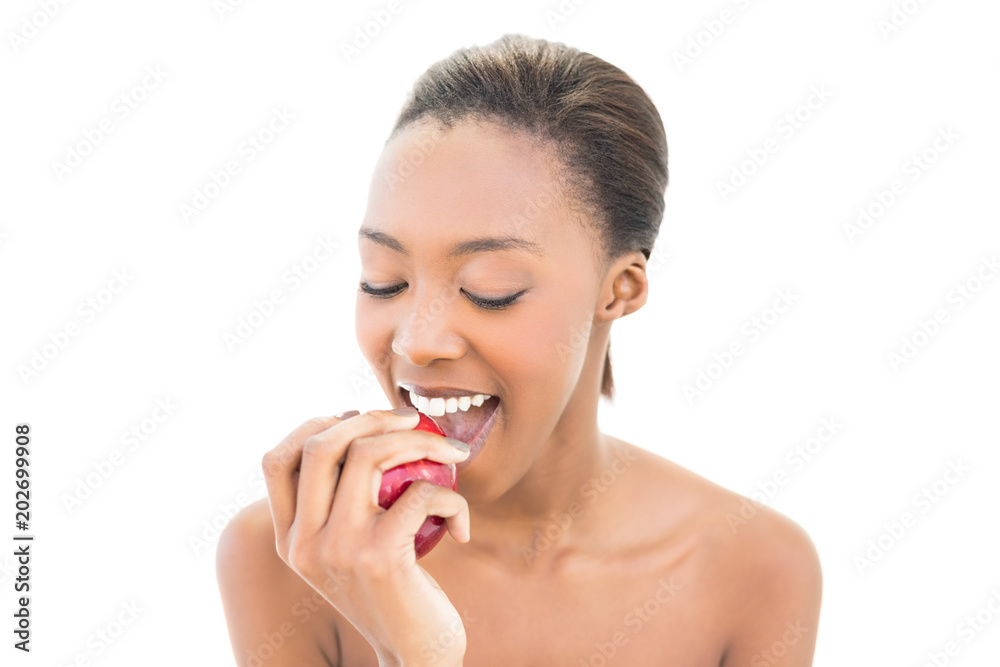 Natural beauty with closed eyes biting apple Natural beauty with closed eyes biting apple