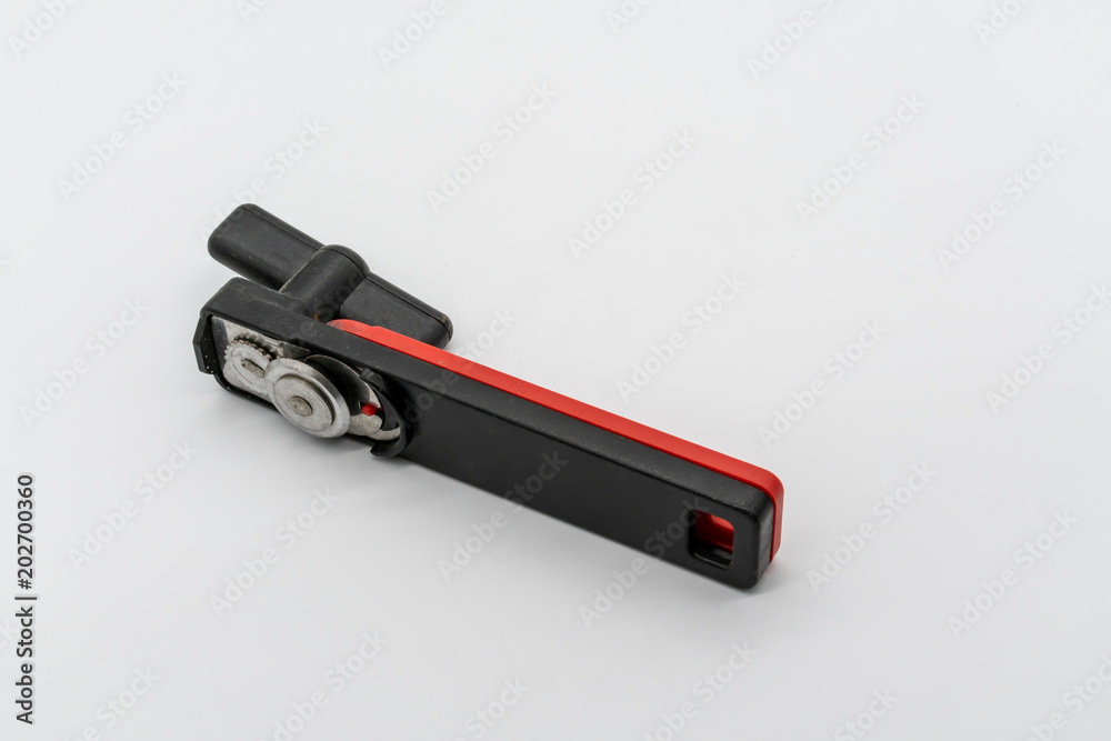 Modern Black and red can opener on a white background Modern Black and red can opener on a white background