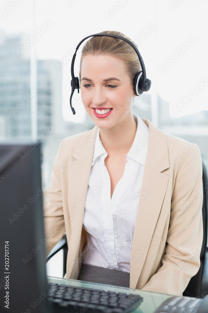 Happy pretty agent wearing headset dealing with customer Happy pretty agent wearing headset dealing with customer
