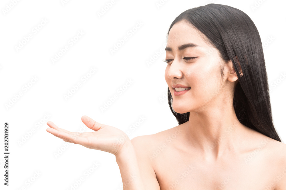 Beautiful young woman showing open hand palm presenting with copy space for product isolated on white background Beautiful young woman showing open hand palm presenting with copy space for product isolated on white background