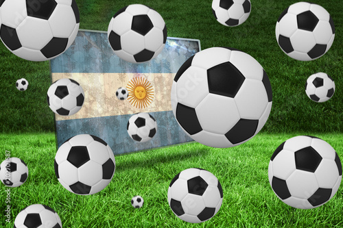 Black and white footballs against argentina flag in grunge effect © vectorfusionart