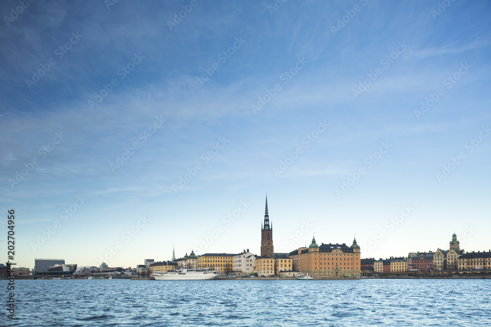 Beautiful scenic panorama of the Old City (Gamla Stan) cityscape pier architecture with historic town houses with colored facade in Stockholm, Sweden. Creative landscape photography