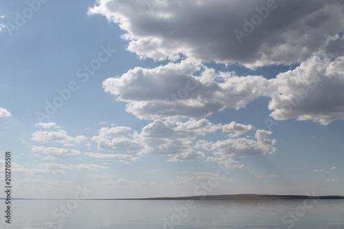 the sky reflected in the water  deserted beach lake  summer sky  nature  blue cloud 