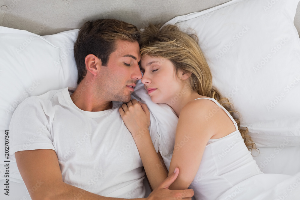 Couple sleeping together in bed Couple sleeping together in bed