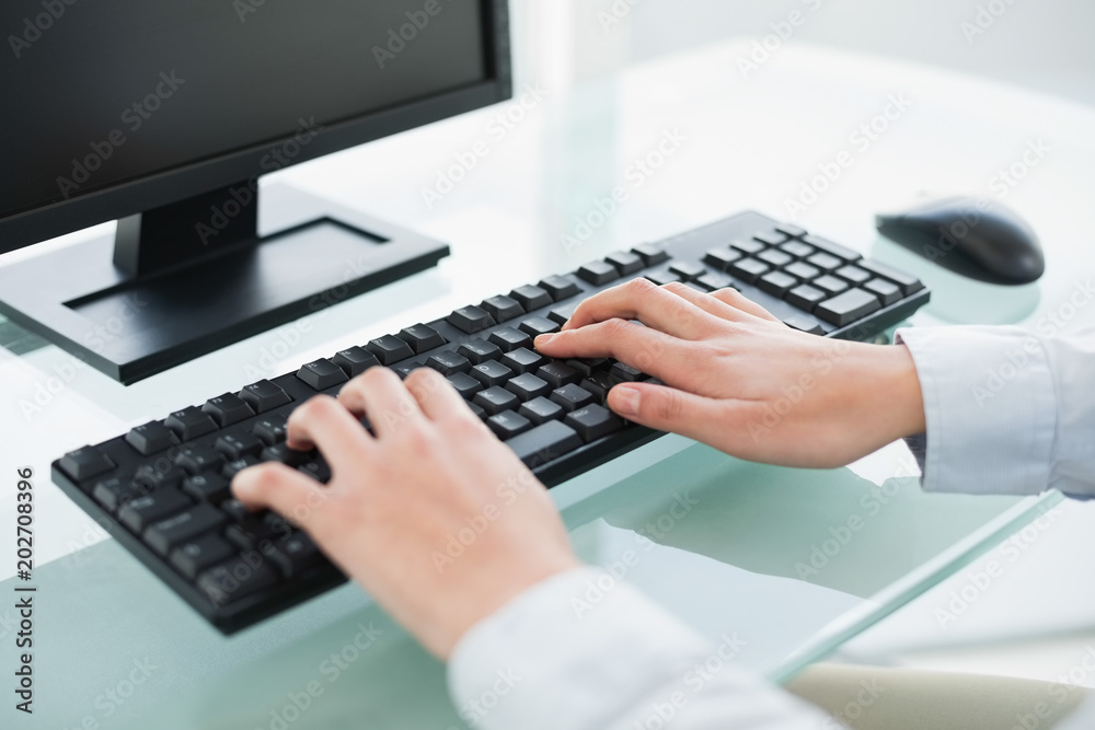 Close up of a businesswoman using a computer Close up of a businesswoman using a computer
