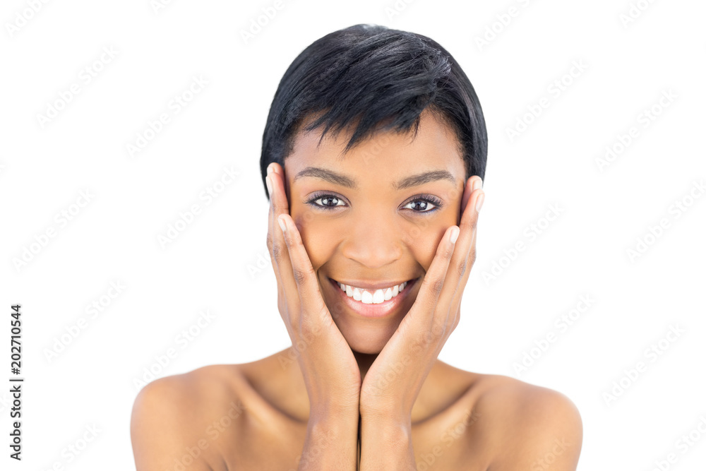 Joyful black haired woman posing holding her head Joyful black haired woman posing holding her head
