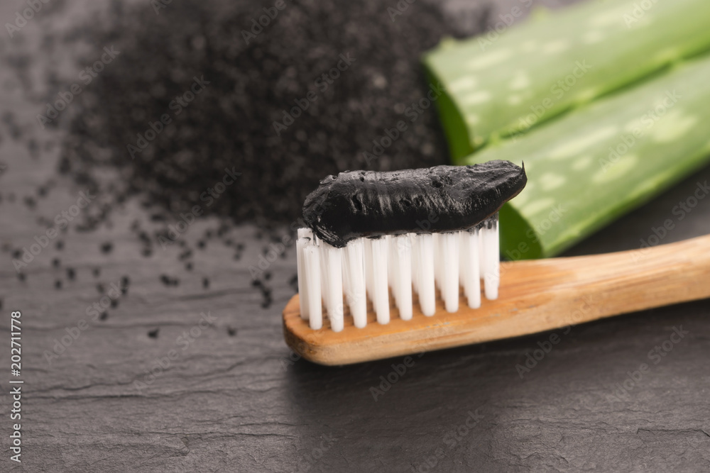 Toothbrush with black charcoal toothpaste with aloe vera Toothbrush with black charcoal toothpaste with aloe vera