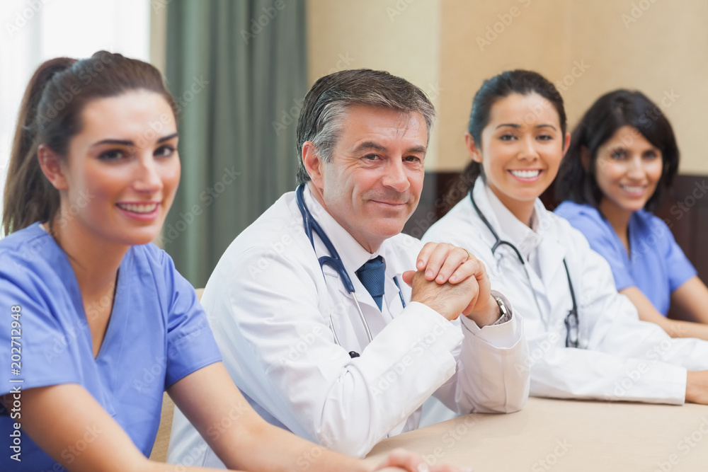 Smiling panel of doctors and nurses Smiling panel of doctors and nurses