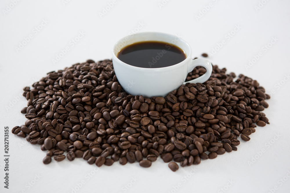 Cup of black coffee with roasted coffee beans Cup of black coffee with roasted coffee beans