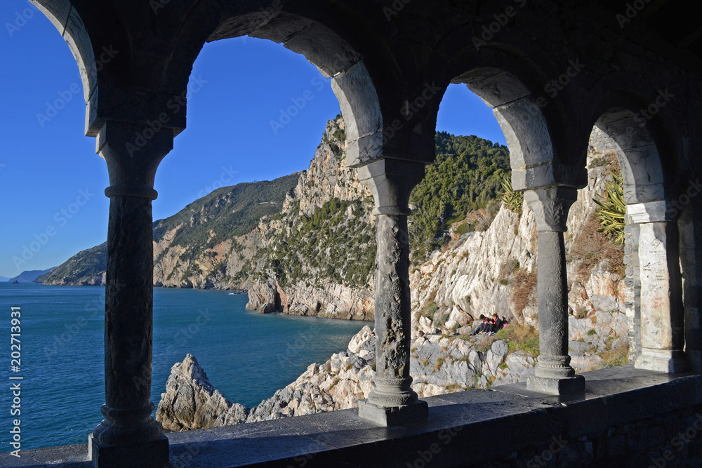 Liguria, Italy, january 2017, ancient stone arches overlooking the sea and the rocky hills in Porto Venere