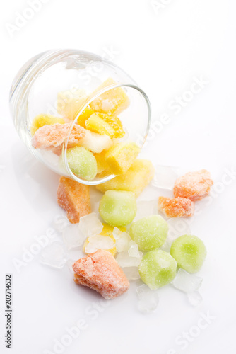 frozen exotic fruits on white background