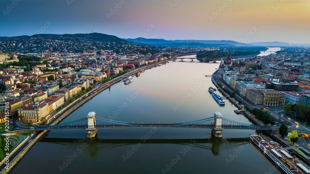 Budapest, Hungary - Aerial skyline view of Budapest above River Danube with famous Szechenyi Chain Bridge, Hungarian Parliament and colorful sky