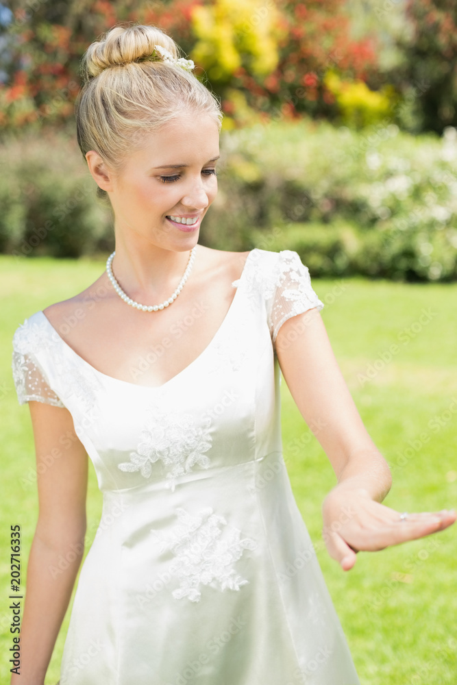 Happy bride looking at her ring Happy bride looking at her ring