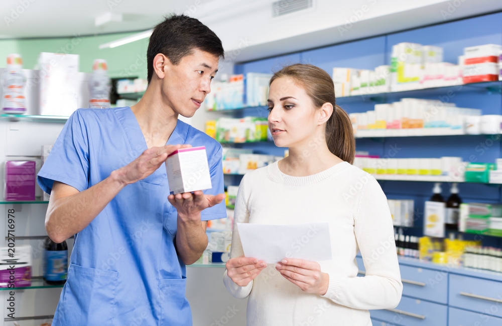 Adult client asking pharmacist about medicines