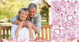 Elderly man hugging his wife who is on the bench against valentines pattern