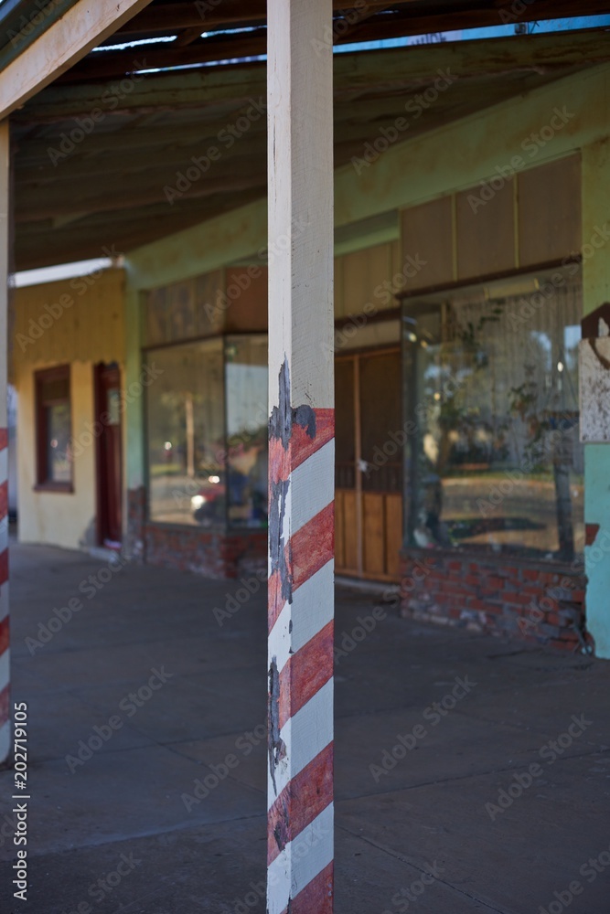 Barber Shop Pole outside abandoned shop