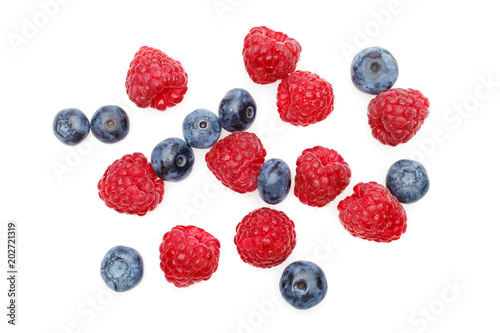 blueberry and raspberry berries isolated on white background