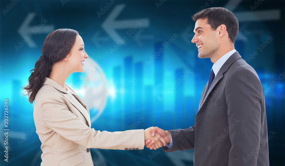 Future partners shaking hands against global business graphic in blue Future partners shaking hands against global business graphic in blue