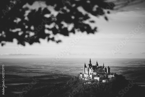 Beautiful view on the Castle Hohenzollern in Germany. Black and white landscape photo of a Castle on top of the hill © makeitanyway