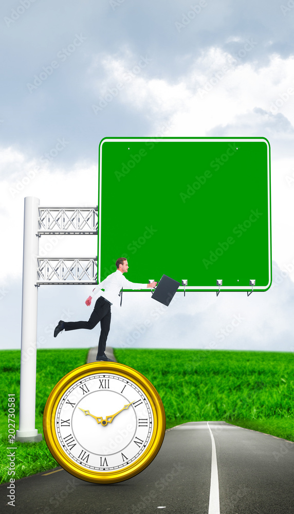 Φωτογραφία Businessman walking with his briefcase against road leading out to the horizon