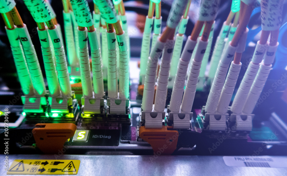 Server rack audio cable. Fiber Optical connector interface for Cards  Equipment DWDM telecommunications. Rack Mounted Servers In A Server Room.  Severs computer in a rack at the large data center Stock Photo