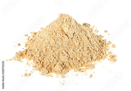 Heap of dried ginger powder isolated on white background