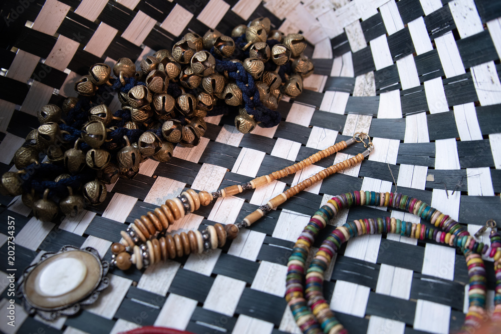 Fototapeta Jewellery with dance cymbals in a black and white basket