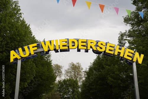 Goodbye sign at the exit of the amusement park in Leipzig, Germany (Kleinmesse) photo