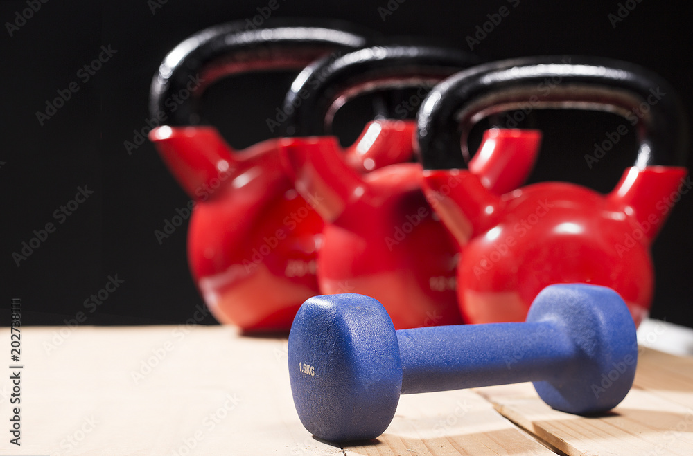 red kettlebells on rough surface.copy space red kettlebells on rough surface.copy space