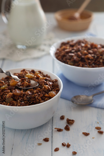 Bowls of granola with raisins and seeds