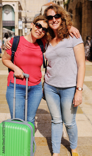 Portrait attarctive mature women traveling together, have fun, smiling, lovely moments. Best friends. photo