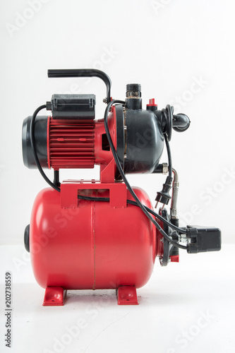 Red surface water pump. White background