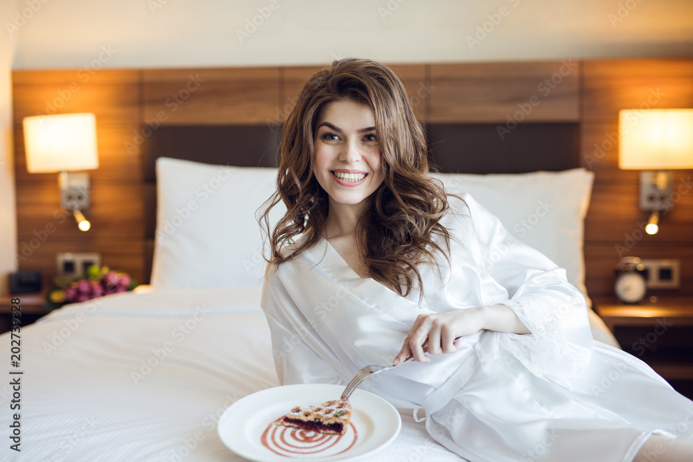 Young woman eating breakfast Young woman eating breakfast