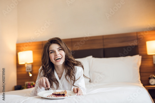 Happy woman with breakfast