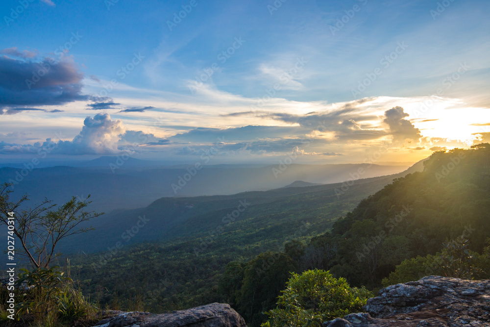 Sunset view looking over form the cliff in the forest mountain landscape. Phu Kradueng National Park, Thailand