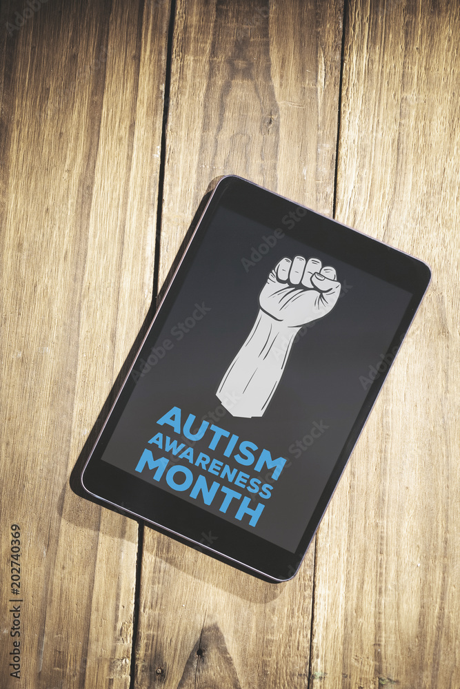 Autism awareness month against overhead of tablet on desk Autism awareness month against overhead of tablet on desk