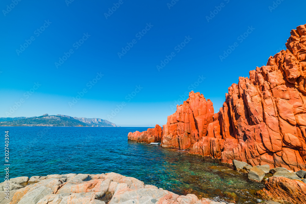 Red Rocks and blue sea in Rocce Rosse beach