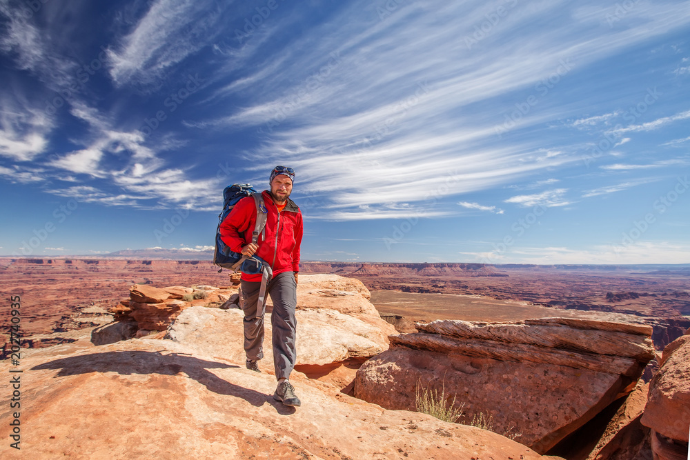 Hiker in Canyonlands National park in Utah, USA Hiker in Canyonlands National park in Utah, USA
