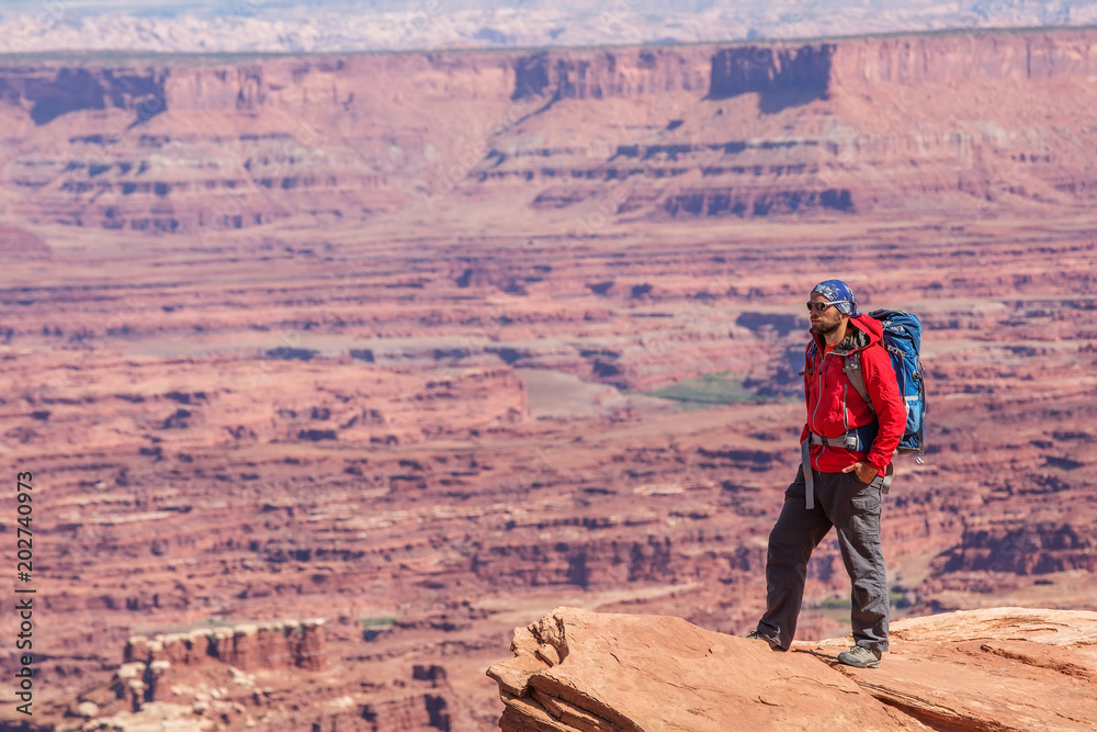 Hiker in Canyonlands National park in Utah, USA Hiker in Canyonlands National park in Utah, USA