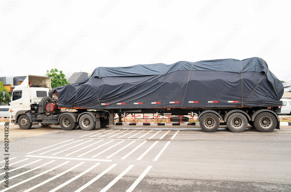 Fototapeta premium trucks Logistic by Cargo truck Import Export business and Industrial on the road . 
