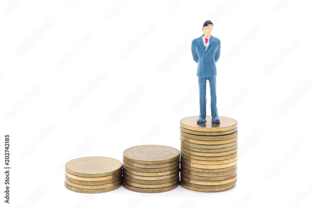 Miniature businessman and coins on white background Miniature businessman and coins on white background