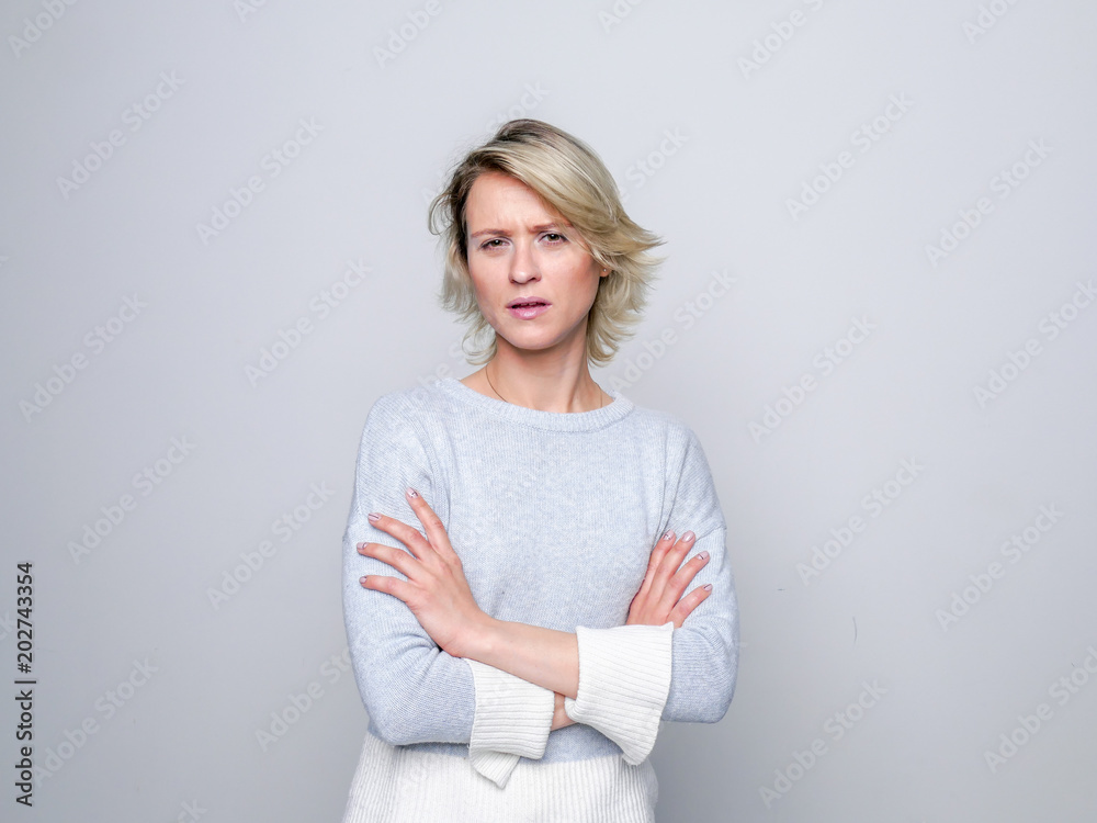 Adult sad woman posing in studio. Negative emotions.. Adult sad woman posing in studio. Negative emotions..