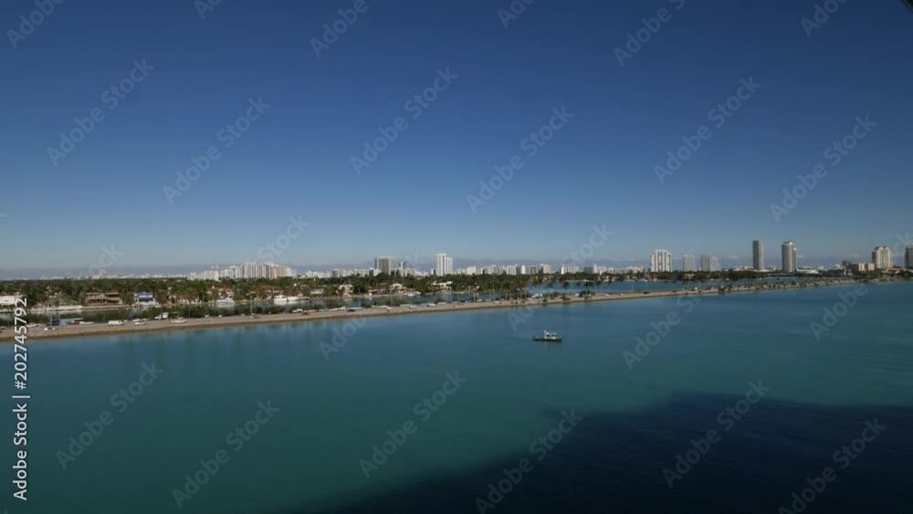 Side view of Miami coast line with skyscrapers on a bright day. Side view of Miami coast line with skyscrapers on a bright day.