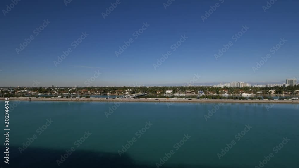 View of Miami coast line with skyscrapers on a bright day. View of Miami coast line with skyscrapers on a bright day.
