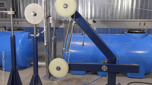 Production of cable products. Rollers on rewind and a tension of an electric cable