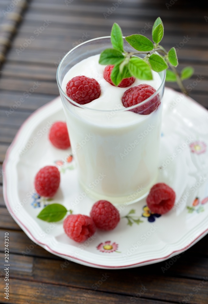 Yogurt with fresh berries on dark background Yogurt with fresh berries on dark background